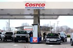 Drivers fuel up at a Costco gas station in Roseville, Mich.