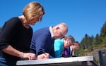 (Left to Right) NOAA Administrator Kathryn Sullivan, California Governor Jerry Brown, Interior Secretary Sally Jewell and Pacific Power CEO Stefan Bird sign two new Klamath Basin water deals on April 6, 2016.