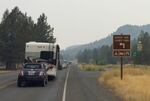 A line of traffic from the Symbiosis Festival files out of the Ochoco National Forest near Prineville.