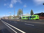 A new TriMet FX bus is parked along the Division Street route between Downtown Portland and Gresham.