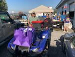 Volunteers Tabitha Swinehart and Brian Coggins near Jonesborough, TN load hot meals onto a utility vehicle to deliver food on roads that are no longer accessible by car.