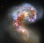 This image made by the NASA/ESA Hubble Space Telescope shows the Antennae galaxies, formerly separate galaxies that have spent the last few hundred million years intertwining with one another.