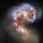 This image made by the NASA/ESA Hubble Space Telescope shows the Antennae galaxies, formerly separate galaxies that have spent the last few hundred million years intertwining with one another.