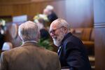 Democratic Oregon state Sen. Arnie Roblan speaks with a fellow state senator before the Oregon Senate convenes at the Oregon Capitol in Salem, Ore., Tuesday, April 2, 2019.