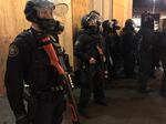 Protesters in downtown Portland were told to move or risk arrest during a large demonstration on Inauguration Day.