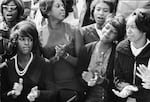 People clap and sing along to a freedom song between speeches at the March on Washington for Jobs and Freedom in 1963.