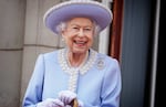 June 2, 2022: Queen Elizabeth II watches with a smile from the balcony of Buckingham Palace after the Trooping the Color ceremony in London on the first of four days of celebrations to mark the Platinum Jubilee.