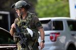 Police respond to a person believed to be armed barricaded inside a home in the Sellwood neighborhood of Portland, Ore., Sunday, June 28, 2020.