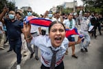 A demonstrator shouts slogans during a protest outside the Parliament in Kathmandu on Sept. 8.