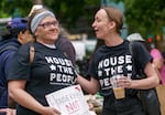 Michelle Hornbeck, left, and Emily Ausman protest outside Portland City Hall, May 31, 2023. The Portland City Council heard over five hours of testimony on a proposal to ban homeless camping on public property in Portland.