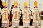 Newly consecrated Bishops, from left, Marc Hanappier, Michel Poinsinet de Sivry, Michael Goldade and Pascal Schreiber wearing their miters and holding their pastoral staffs, stand at the end of their consecration ceremony in a tent set up outside the Society of St. Pius X seminary in Econe, Switzerland, Wednesday, July 1, 2026.