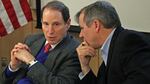 Oregon Senators Ron Wyden, left, and Jeff Merkley met with local officials in Portland to discuss oil train safety earlier this year. Now they're calling for a new fund devoted to it.
