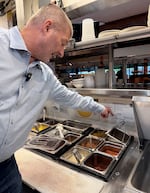 Mike Christman,  a registered environmental health specialist for Multnomah County, conducts a routine inspection of Black Bear Diner on May 13, 2026.