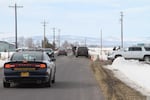 Law enforcement vehicles leave the Burns airport. The armed occupation of the Malheur National Wildlife Refuge ended Thursday, Feb. 11.