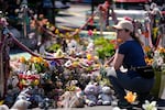 One person visits George Floyd at George Floyd Square for the fifth anniversary of Floyd's death, Sunday, May 25, 2025, in Minneapolis. Portland closes this weekend to commemorate numerous cities across the country.