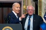 President Biden stands with Sen. Bernie Sanders, I-Vt., on April 3, 2024. Four years ago, Sanders endorsed Biden, and the former rivals worked together to craft policy proposals that bridged Democratic divides.