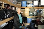Karen Andreika surveys supplies in her neighborhood's emergency cache in Depoe Bay, Ore., on Jan. 13, 2025.