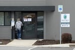 FILE - A woman enters the Great Circle drug treatment center in Salem, Ore., on March 8, 2022. In 2020, Oregonians voted to decriminalize drugs and dedicate hundreds of millions of dollars to treatment services.