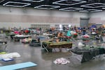 Hundreds have sought shelter at a cooling center at the Oregon Convention Center in Portland, June 28, 2021. The cooling center provided water, snacks, meals, blankets, and cots or mats for sleeping.