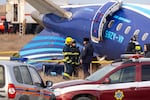 Emergency specialists work at the crash site of an Azerbaijan Airlines passenger jet near the western Kazakh city of Aktau. The Embraer 190 aircraft was supposed to fly northwest from the Azerbaijani capital Baku to the city of Grozny in Chechnya in southern Russia, but instead diverted far off course across the Caspian Sea. It crashed on December 25, 2024 near the city of Aktau in Kazakhstan.