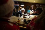 John Spaccarotelli shakes hands with a customer on Friday, Dec. 19, 2025, during the last night of business at the Shanty Tavern.