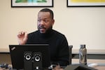 At the St. John’s Community Health clinic in South Los Angeles, Darryn Harris teaches health workers about patients’ constitutional right to remain silent during immigration arrests.