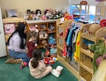 Students in David Douglas’ preschool play with one of the high school students in the early childhood education career technical education program. Students in the program get experience teaching and working with preschool students as part of a class.