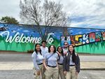 Brandon Fernandez, second from left, with AmeriCorps colleagues in North Carolina this year, where they were helping with disaster recovery after Hurricane Helene. He and others struggled to hold back tears when their deployment was cut short.