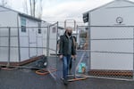 Tina Kotek toured the sleeping pod areas at Arbor Lodge in North Portland on her last day in office as Oregon House speaker last year. Now, in her first days as governor, she's promising aggressive action on housing. 