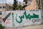 Graffiti on a building in the Palestinian village of Kafr Ni'ma in the occupied West Bank on March 24.