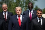 British Prime Minister Keir Starmer, President Trump, Kenya's President William Ruto and French President Emmanuel Macron pose for a photo during the G7 summit on Tuesday in Evian-les-Bains, France.