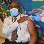 Oregon Department of Corrections Chief Medical Director Dr. Warren Roberts receives his first dose of the coronavirus vaccine.