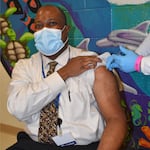 Oregon Department of Corrections Chief Medical Director Dr. Warren Roberts receives his first dose of the coronavirus vaccine.