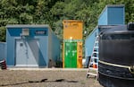 The Bull Run treatment pilot program is housed in these two small buildings, seen here on July 16, 2024. This pilot is intended to fine tune the process of filtering out cryptosporidium and wildfire ash from the water before building a larger, more permanent facility. 