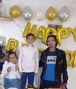 Eman Abusaeid's children, Joudi and Ziyad, and her husband, Iyad.