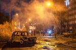 A burned car is seen after a Russian missile attack in Kyiv, Ukraine, Saturday, Aug. 1, 2026. (AP Photo/Dan Bashakov)