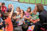 Gov. Kate Brown asks a question of kindergarteners at Nancy Ryles Elementary School in Beaverton, on the first day of school, Sept. 8, 2015.