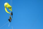 A protester releases a flag that was lowered down from the St. Johns Bridge Wednesday, July 29, 2015. Protesters hung from the bridge in protest to block a Shell icebreaker which was scheduled to return to Alaska.