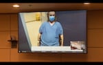 Benjamin Jeffery Smith appears in court by video for his arraignment on charges, including murder, attempted murder and assault with a firearm, on March 24, 2022, in Portland, Ore. Smith allegedly shot five people - one died and one became paralyzed - during a February racial justice protest at Normandale Park.