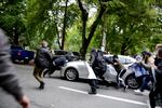 A car speeds into a protester attempting to stop traffic for demonstrators Oct. 6, 2018.