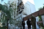 Rescuers work at the damaged apartment building following a Russian air attack in Lviv, Ukraine, Thursday, July 30, 2026.