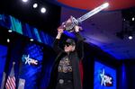 Elon Musk wielding a chainsaw at the Conservative Political Action Conference (CPAC) on Feb. 20, 2025 in Oxon Hill, Md.