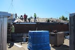 File photo from 2013 showing construction on the Wilson High School roof.