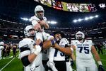 Utah State football players celebrate winning the LA Bowl.