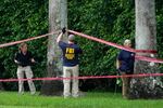 Law enforcement officials work at the scene of the Trump International Golf Club in the aftermath of the assassination attempt of Republican presidential nominee and former President Trump on Sept. 17, 2024, in West Palm Beach, Fla.