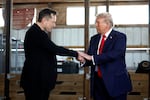 President-elect Trump shakes hands with Elon Musk at a campaign stop in Butler, Pa., on October 5, 2024. Trump has named Musk and former presidential hopeful Vivek Ramaswamy co-leaders of a new commission called the "Department of Government Efficiency," which will advise and guide Trump in his quest to "dismantle government bureaucracy."