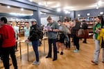 People line up to checkout romance novels at Grand Gesture Books at its grand opening on Oct. 26, 2024 in Portland, Ore. Grand Gesture is Oregon's first romance-only bookstore.