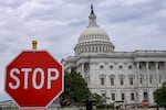 A stop sign stands in front of the U.S. Capitol in Washington, D.C. 
