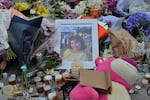 A photo of shooting victim Matilda, a 10-year-old whose last name has been withheld at the request of her family, is placed amongst flowers at a memorial made at the Bondi Pavilion in Sydney, Dec. 17, 2025, following Sunday's shooting.