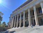 Students walk up the steps of the Harry Elkins Widener Memorial Library on the campus of Harvard University.
